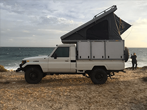 Toyota Land Cruiser with pop-up tent on top